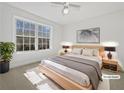 Virtually staged bedroom with large windows and plush bedding at 60 Legend Creek Holw, Douglasville, GA 30134