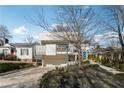 Modern home with a two-car garage, light-colored facade, clean lines, and landscaped front yard at 727 Berkeley Nw Ave, Atlanta, GA 30318