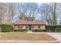 Traditional-style home with neat landscaping, windows, and a driveway at 3847 Admiral Dr, Chamblee, GA 30341