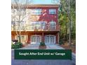 Rear of the house with a two-car garage and back deck; surrounded by mature trees at 5430 Glenridge Vw # 1601, Sandy Springs, GA 30342