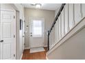 Bright entryway with hardwood floors and staircase at 1304 Wedgewood Ct, Atlanta, GA 30350