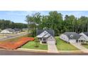 An aerial view of a house in a residential neighborhood at 305 Sobeck Way, Canton, GA 30115