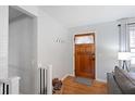 Bright entryway with hardwood floors and a charming wooden front door at 15 E Georgia Ave, Emerson, GA 30137