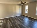 Spacious living room with hardwood floors and ceiling fan at 380 River Trace Dr, Villa Rica, GA 30180