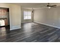 Open living area with hardwood floors and kitchen view at 380 River Trace Dr, Villa Rica, GA 30180