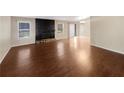 Spacious living room showcases hardwood floors and a fireplace at 4095 Maxanne Nw Dr, Kennesaw, GA 30144