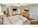 Virtually staged main bedroom with hardwood floors and en-suite bathroom at 4095 Maxanne Nw Dr, Kennesaw, GA 30144