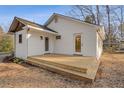 Newly constructed backyard deck extends from the home, with easy access to the yard at 2046 Harold Se Ave, Smyrna, GA 30080