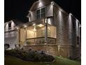 House exterior at night, showing lights and landscaping at 2308 Hanover Woods Rd, Lithonia, GA 30058