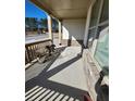 Front porch with wooden railing and potted plants at 2308 Hanover Woods Rd, Lithonia, GA 30058