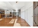 Bright foyer featuring hardwood floors, white wainscoting, and an open staircase at 100 Pine Sandy Bank Dr, Canton, GA 30114