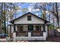 Charming home showcasing a front porch with flower boxes and a well-manicured yard at 530 Bolton Nw Rd, Atlanta, GA 30331