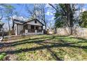 Inviting front yard featuring a lush lawn and a charming, tree-lined setting at 530 Bolton Nw Rd, Atlanta, GA 30331