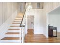 Two-story entryway with hardwood floors and a chandelier at 3964 Preston Ne Ct, Brookhaven, GA 30319