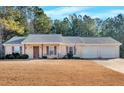 Ranch style home with two-car garage and spacious yard at 761 Woodwind Dr, Rockmart, GA 30153