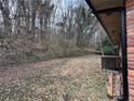 Wooded backyard with a sloping terrain at 126 Meadow Park Sw Ln, Atlanta, GA 30315