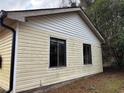 Light yellow vinyl siding with two windows at 126 Meadow Park Sw Ln, Atlanta, GA 30315