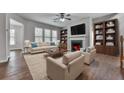 Inviting living room with fireplace, built-in bookshelves and comfortable seating at 300 Downing Creek Trl, Canton, GA 30114