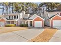 Front view of a townhome with a brick facade and landscaping at 849 Hillandale Ln, Lithonia, GA 30058