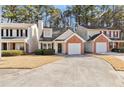 Townhouse exterior featuring a brick facade and driveway at 849 Hillandale Ln, Lithonia, GA 30058