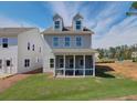 Enjoy outdoor living with a screened-in porch overlooking a spacious backyard and neighboring house at 107 Winsome Way, Woodstock, GA 30188