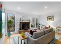 Bright living room with a fireplace, hardwood floors, and stylish decor at 320 Tuxworth Cir, Decatur, GA 30033