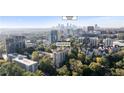 Aerial view of a high-rise condo with downtown Atlanta in the background at 1 Biscayne Nw Dr # 809, Atlanta, GA 30309