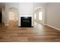 Living room featuring a fireplace, hardwood floors, and an open floor plan at 3301 Cascade Parc Blvd, Atlanta, GA 30311