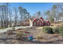 Brick home with a large yard and mature trees, perfect for families at 4035 Powerscourt Pl, Suwanee, GA 30024