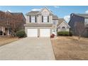 Charming two-story home featuring a well-maintained yard, two-car garage, and neutral color palette at 4035 Crabapple Lake Ct, Roswell, GA 30076