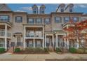 Beautiful brick townhome exteriors with covered entrances, balconies, and professional landscaping at 2203 Fullers Aly, Kennesaw, GA 30144