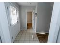 Inviting foyer with a tiled floor, white door, and a view into other rooms at 2904 Pleasant Ridge Dr, Decatur, GA 30034
