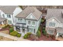 Beautiful home with a balcony, covered porch and mature landscaping at 3831 Portland Trail Dr, Suwanee, GA 30024