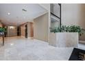 Spacious lobby with marble floors and plant decorations at 25213 Plantation Ne Dr # 25213, Atlanta, GA 30324