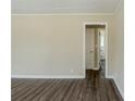 An empty living room featuring laminate floors and neutral walls at 2096 Snow Sw Rd, Atlanta, GA 30311