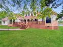 House exterior with a red roof, brick accents, and a well-manicured lawn at 300 Jonesboro Rd, Mcdonough, GA 30253
