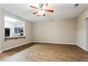 Open living room view into kitchen with breakfast bar and modern appliances at 2229 Bigwood Trl, Atlanta, GA 30349