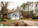 Charming two-story home featuring a two-car garage, basketball hoop and well-maintained front yard at 10945 Pinehigh Dr, Alpharetta, GA 30022