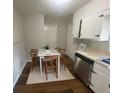 Eat-in kitchen with stainless steel appliances and hardwood floors at 1864 Cindy Dr, Decatur, GA 30032