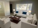 Bright living room featuring white sofas and a coffee table at 1864 Cindy Dr, Decatur, GA 30032