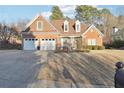 Two-story brick home with a large front yard at 603 Redwood Ln, Canton, GA 30114