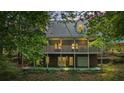 Two-story home with a large deck and a detached garage at 915 Rocky Creek Rd, Hampton, GA 30228