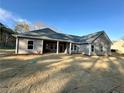 Expansive backyard featuring a covered patio area, perfect for outdoor entertaining at 3740 Cobblestone Dr, Loganville, GA 30052
