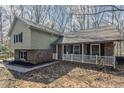 Split-level home featuring a brick and siding exterior and a cozy front porch at 265 N Fayette Ct, Fayetteville, GA 30214