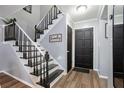 Entryway with black door and staircase at 2251 Pernoshal Ct, Atlanta, GA 30338