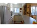 Bright kitchen featuring white cabinets and an open layout to the other rooms at 300 W Peachtree St # 21N, Atlanta, GA 30308