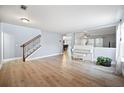 A large open-concept living room with wood flooring and lots of natural light at 296 Cedar Bay Cir, Dallas, GA 30157