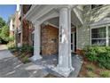 Charming entrance with brick accents and a welcoming doorway at 1965 Nocturne Dr # 1205A, Alpharetta, GA 30009