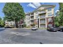 Inviting condo complex with ample parking and mature trees at 1965 Nocturne Dr # 1205A, Alpharetta, GA 30009
