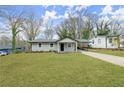 Charming single-story home with a well-maintained front lawn and covered porch at 327 Thornton Sw St, Atlanta, GA 30315